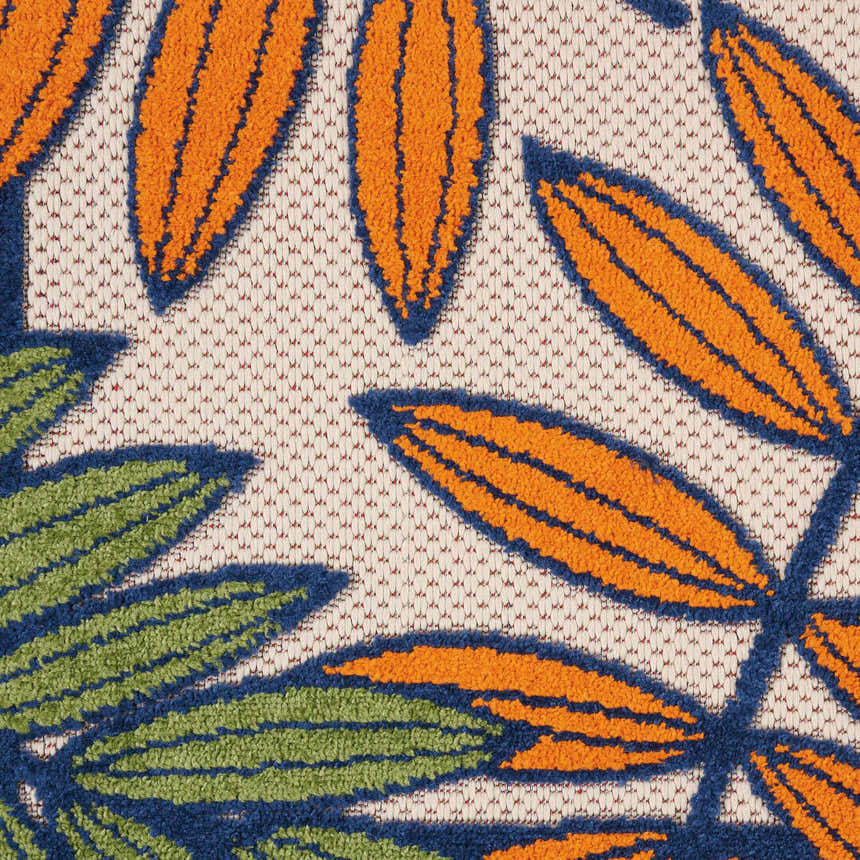 Close-up of Nourison Aloha Multicolor Tropical Area Rug with orange and green leaves on a textured cream background.