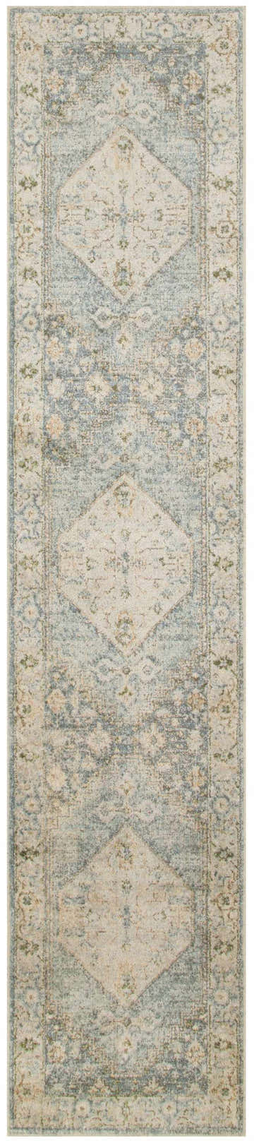 Close-up of Nourison Astra Silver Blue Vintage rug featuring a distressed diamond pattern and border.