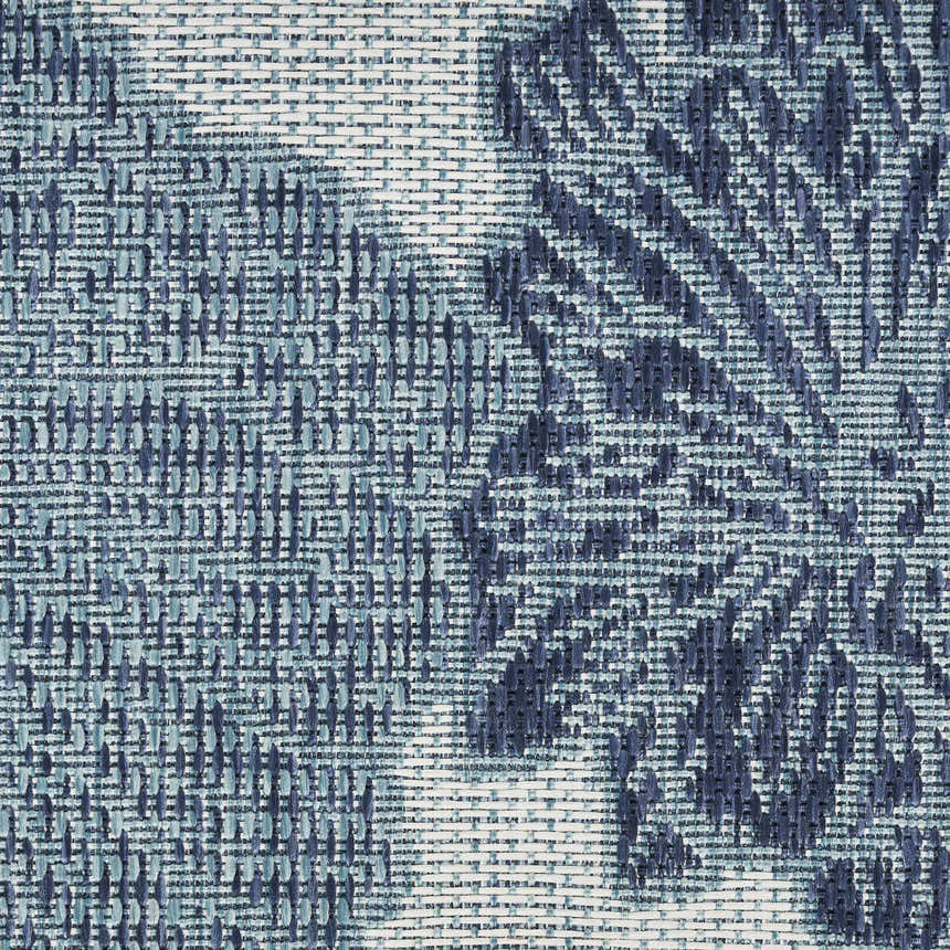 Close-up of the Nourison Garden Oasis Blue Tropical Area Rug featuring blue woven tropical pattern.