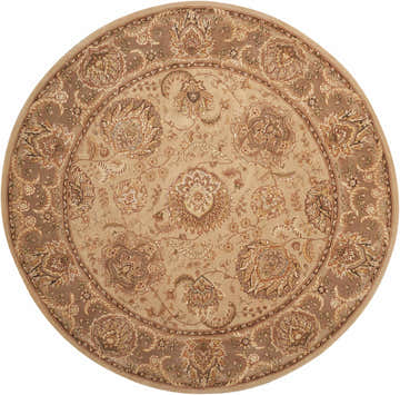 Close-up of round Nourison 2000 Light Gold rug. Handmade wool rug with floral design and neutral, gold tones.