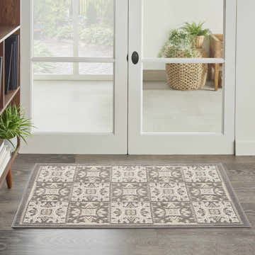 Entryway with Nourison Aloha Ivory Grey Contemporary Area Rug featuring a tile-like pattern and neutral colors.