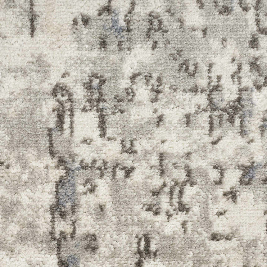 Close-up of the Nourison Quarry Ivory Blue Grey rug. High pile texture with a modern abstract pattern.