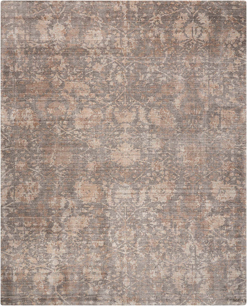 Close-up of Nourison Lucent Flint vintage rug. Bamboo silk-like fiber with distressed floral pattern in flint and beige.