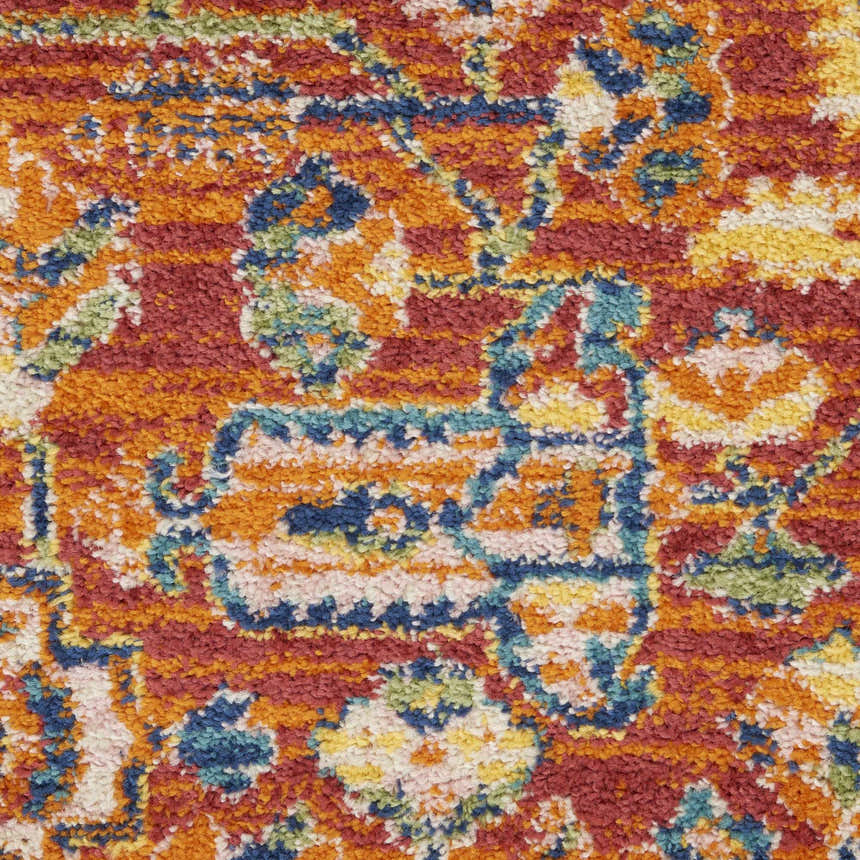 Close-up of Nourison Allur Red Multicolor rug. Bohemian pattern with red, orange, blue, yellow, and green hues. Soft texture.