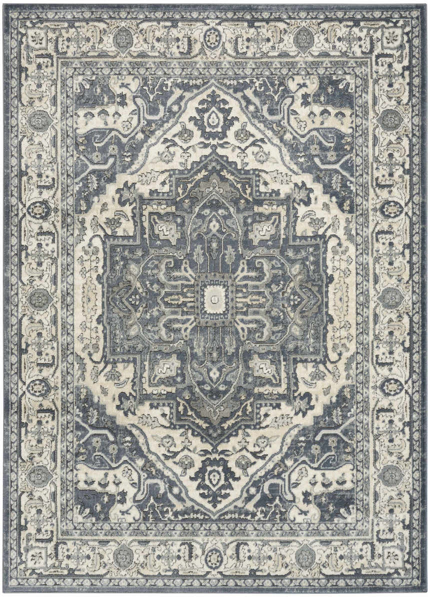 Close-up of the Nourison Quarry Navy Ivory Vintage Indoor Area Rug, showcasing its intricate central medallion and border design.