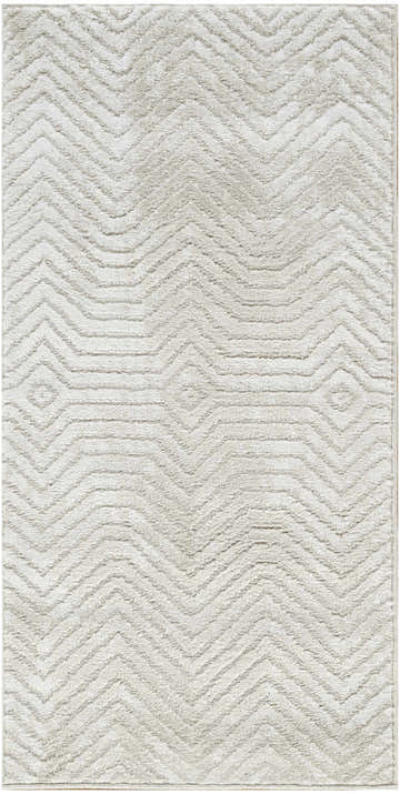 Close-up of the Nourison Dekor Ivory Beige rug showing its high pile texture and modern chevron pattern.