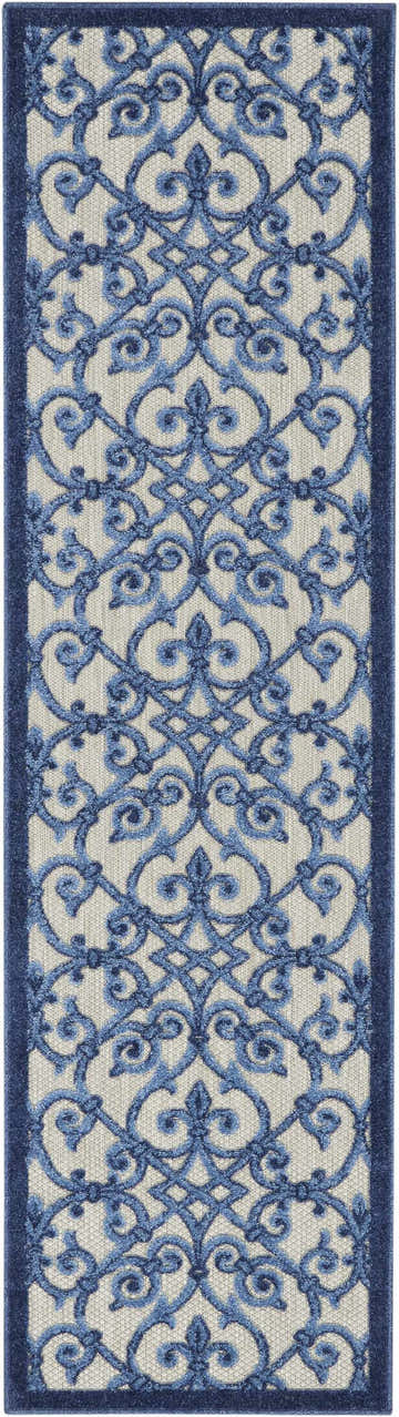 Close-up of the Nourison Aloha Grey Blue Contemporary Area Rug, featuring a blue floral scroll pattern on a gray textured background.