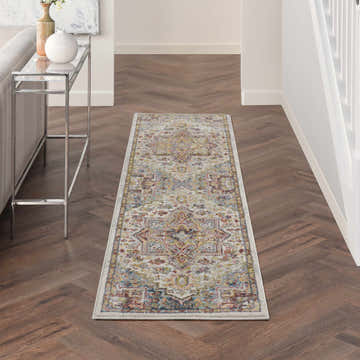 Hallway with Nourison Soraya Ivory Multicolor rug runner on wood floor, silver console table, bright and airy.