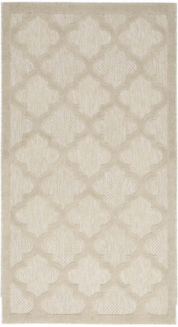 Close-up of the Nourison Easy Care Cream Modern Area Rug featuring a neutral quatrefoil pattern and a textured weave.