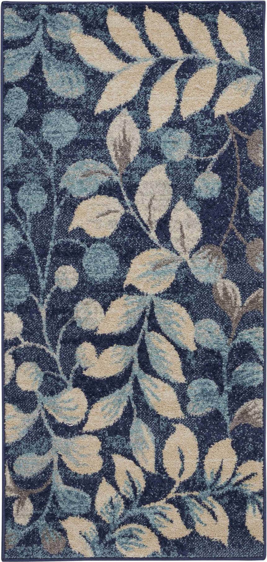 Close-up of the Nourison Tranquil Navy Farmhouse Area Rug, featuring a leaf pattern in navy, beige, and light blue.