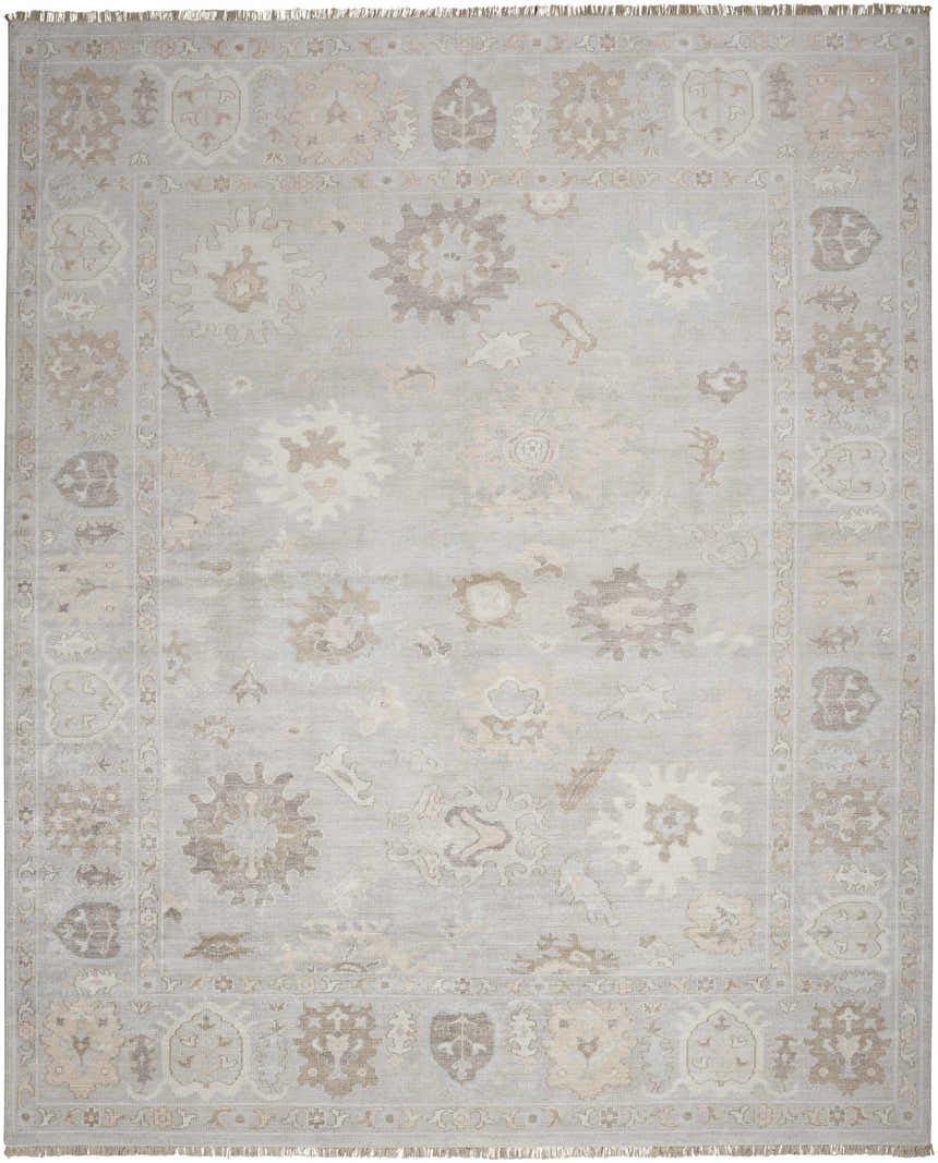 Detailed view of the Nourison Aldora Silver Blue rug. Vintage design with floral and geometric patterns in gray, beige, and ivory.