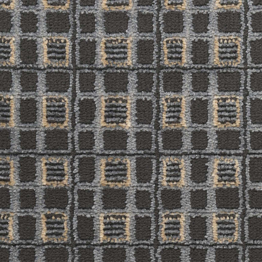 Close-up of the Nourison Nordic Black Taupe Art Deco rug featuring a geometric ivory and black pattern.