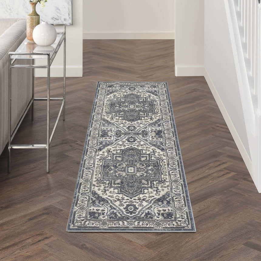 Hallway with Nourison Quarry Navy Ivory Vintage rug runner on dark wood floor.