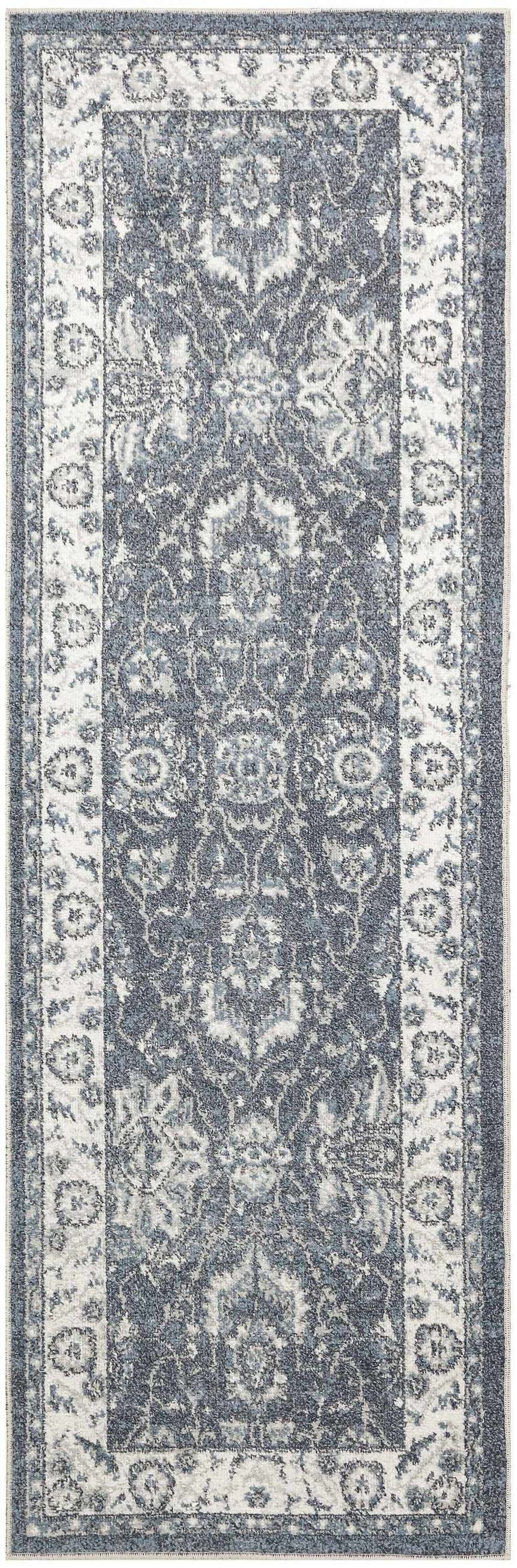 Close-up of Nourison Astra Machine Slate Vintage rug, showing slate blue and taupe vintage pattern.