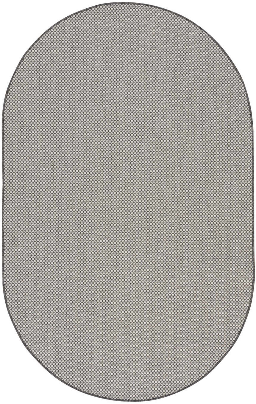 Close-up of an oval Nourison Courtyard Ivory Charcoal rug. It has a geometric diamond pattern in taupe and charcoal.