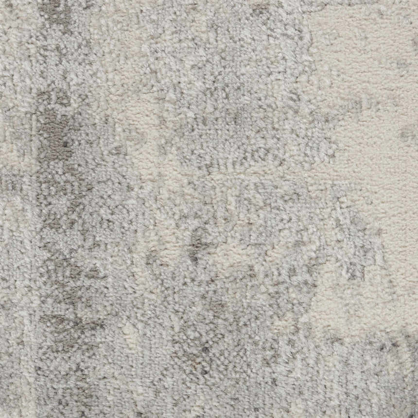 Close-up of the high-pile Nourison Elation Grey Ivory rug, showing its texture and modern abstract pattern.