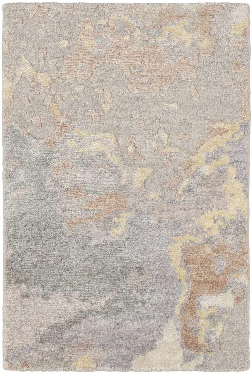 Close-up of Nourison Silk Shadows Silver rug. Abstract design in silver gray, blush, and gold tones. Soft, silk-like texture.