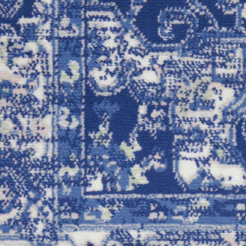 Close-up of the Nourison Whimsicle Navy Farmhouse Indoor Area Rug featuring a detailed blue and white pattern.