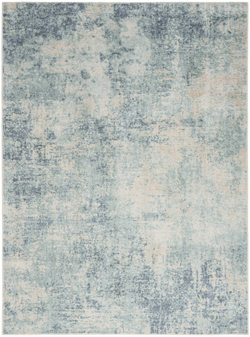 Close-up of Nourison Astra rug. Blue and ivory modern design with a distressed, textured pattern. Machine-made polyester rug.