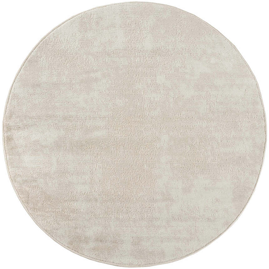 Close-up of the round Nourison Serenity Home Ivory area rug. High pile rug with a subtle, textured pattern.