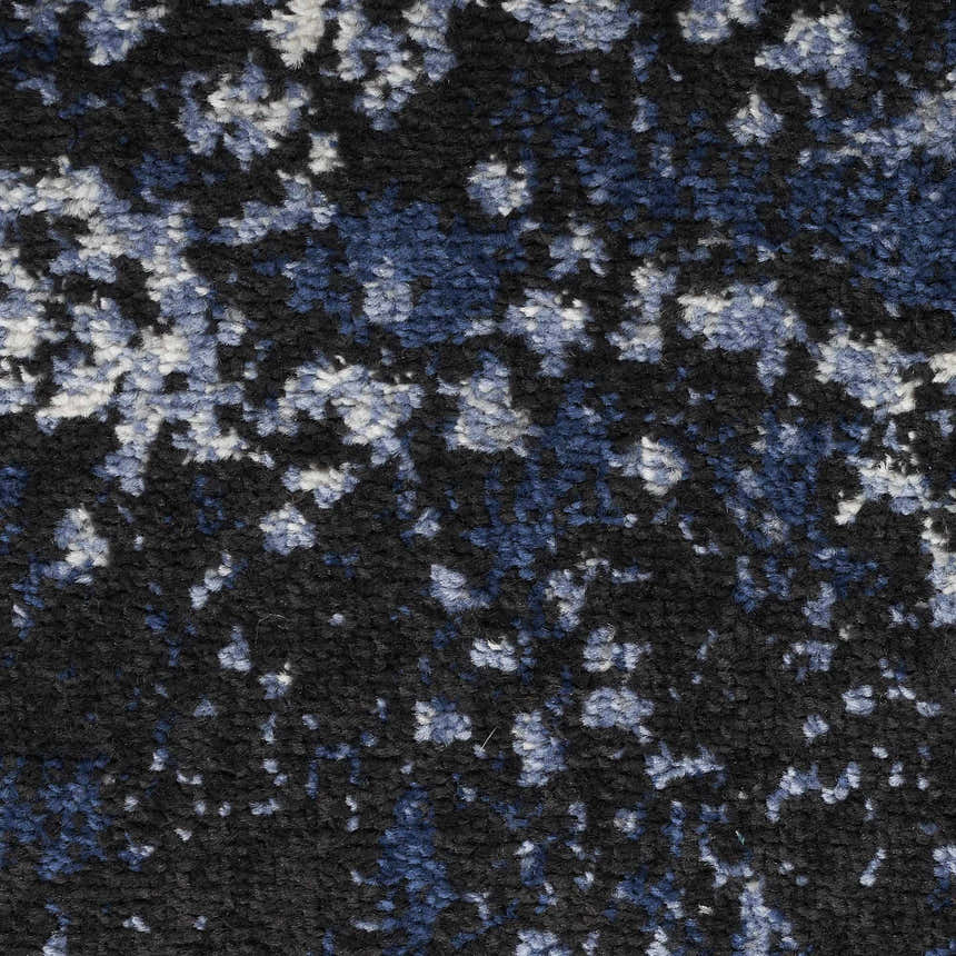 Close-up of the Nourison Passion Light Blue Black rug, showing its abstract pattern and soft, textured pile.