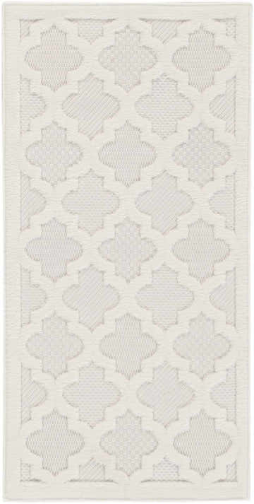 Close-up of the Nourison Easy Care Ivory White rug showing the quatrefoil pattern and subtle chestnut color.