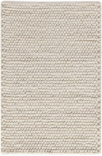 Close-up of the ivory DKNY Pure Knots rug. Handmade pile texture with a modern, nubby design.