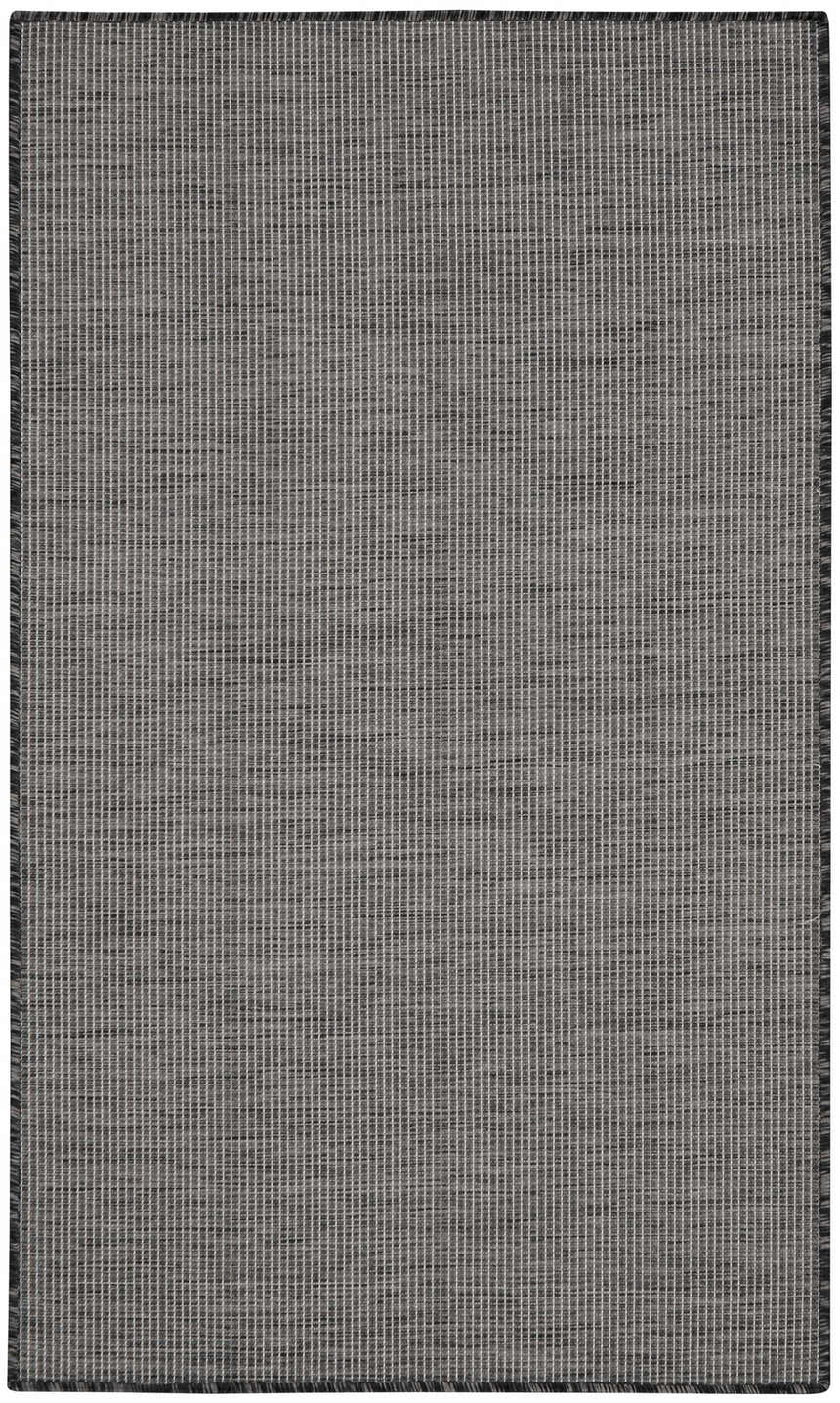 Close-up of the Nourison Positano Charcoal rug showing its woven texture and subtle taupe and charcoal color variations.