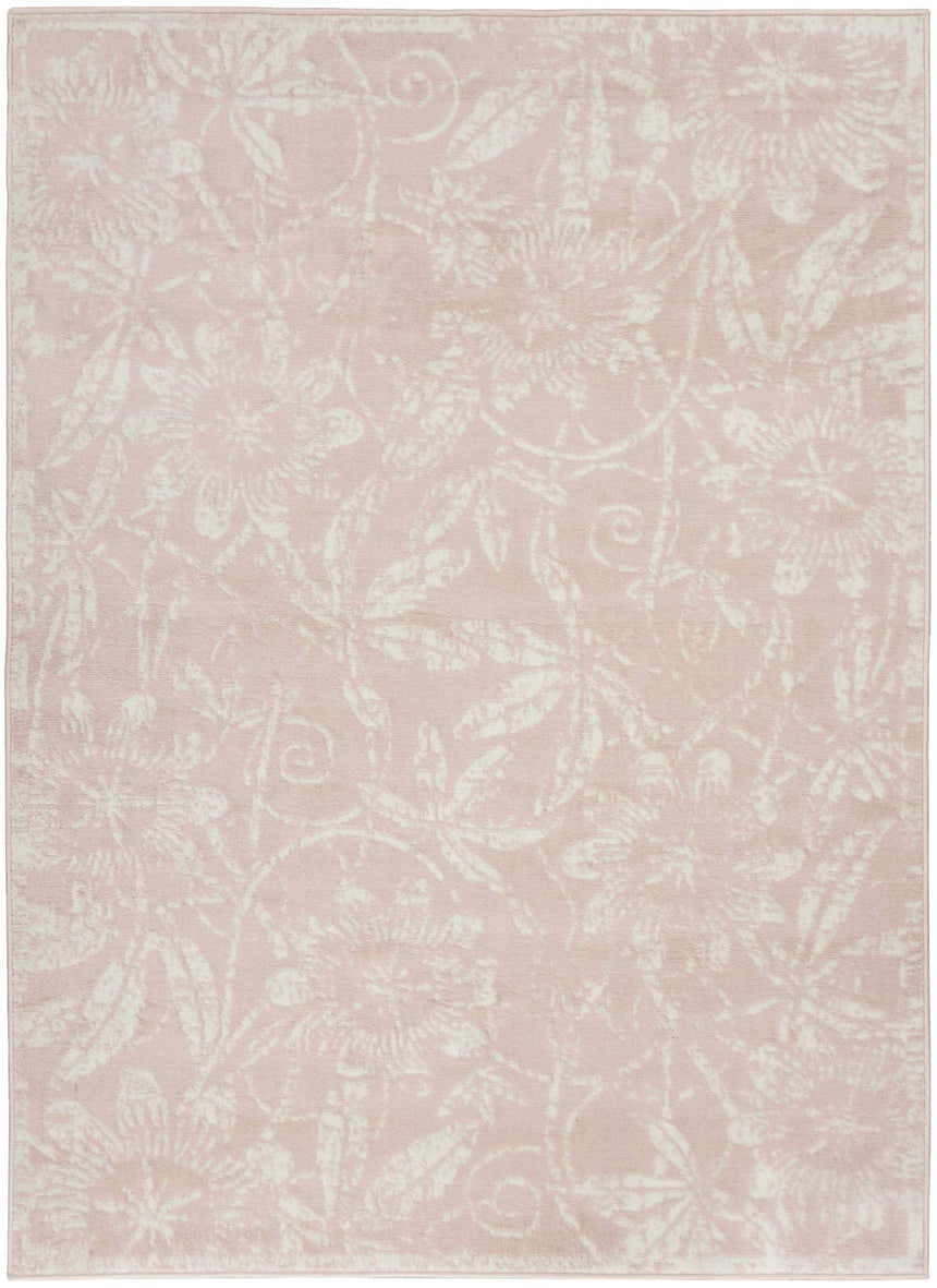 Close-up of the Nourison Whimsicle Pink Farmhouse Area Rug. Floral pattern in light pink and ivory tones.