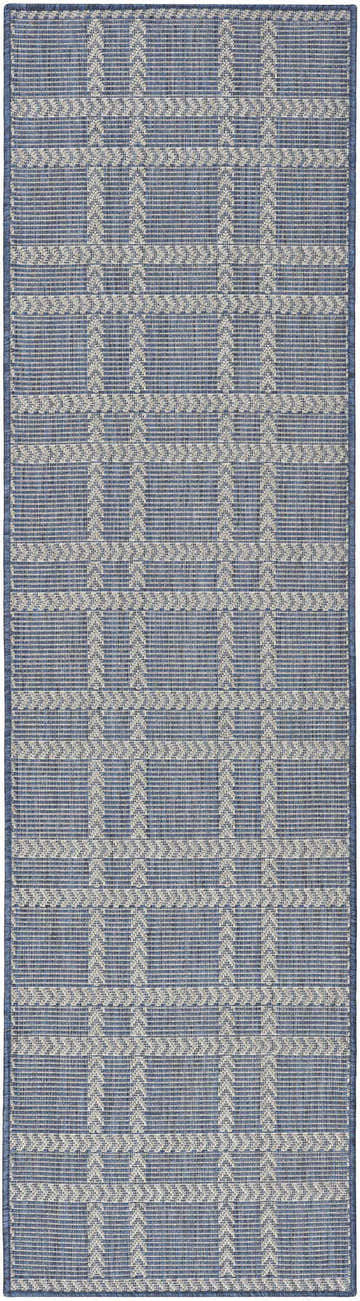 Close-up of Nourison Horizon Navy rug. Features a modern, woven plaid pattern in navy and cream. Great for indoor or outdoor use.