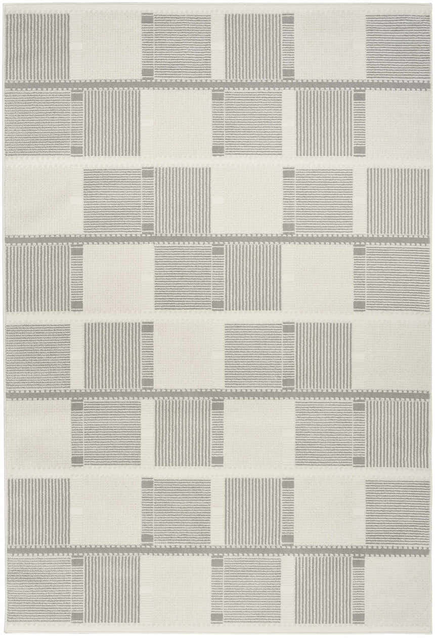 Close-up of the Nourison Nordic Ivory Grey rug featuring a modern, geometric block pattern and subtle texture.