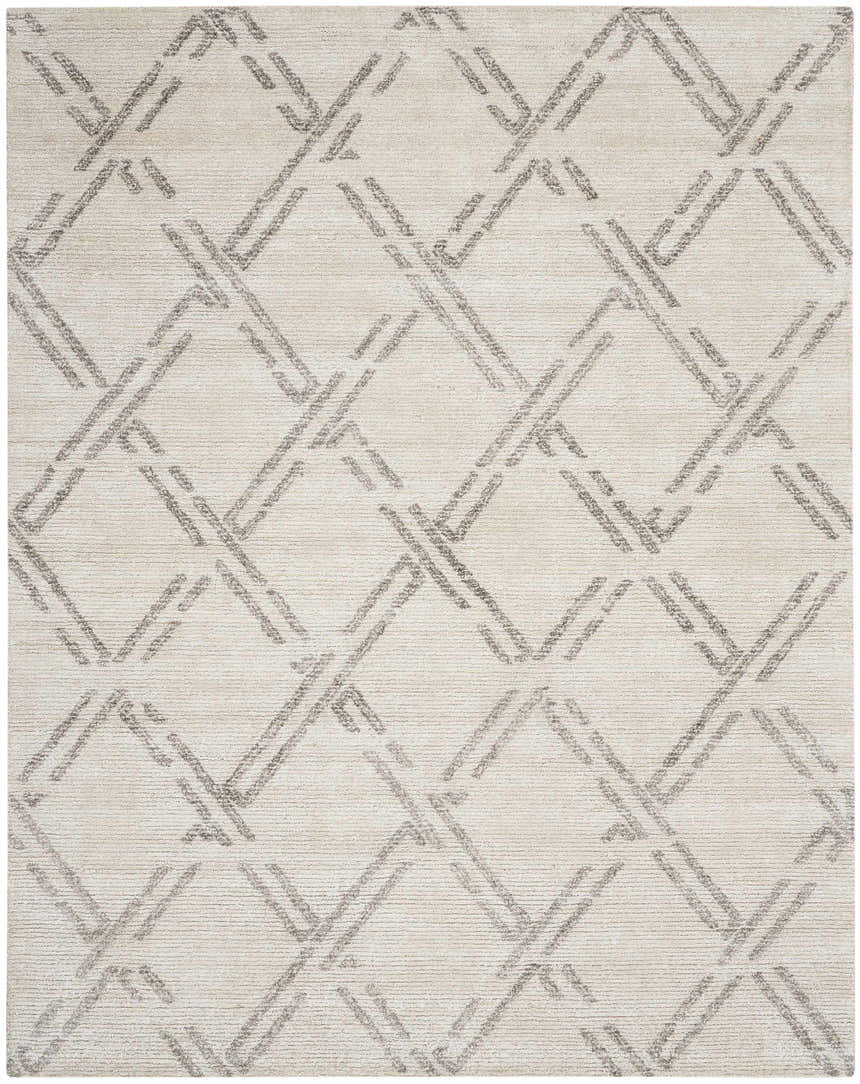 Close-up of Nourison Venosa Ivory/Grey rug. Mid-century modern style with a geometric diamond pattern and subtle texture.