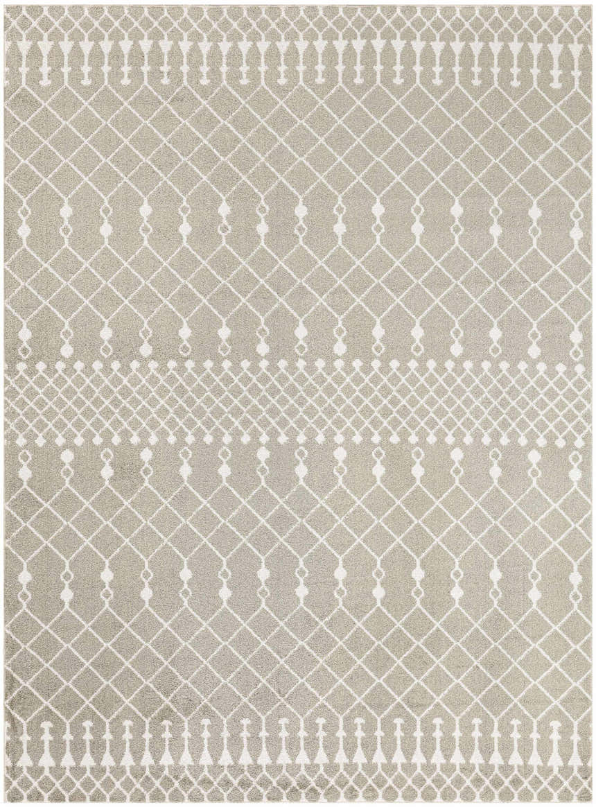Close-up of Nourison Astra Sage Bohemian Rug. Muted sage rug with white geometric diamond and tassel pattern. Machine made texture.