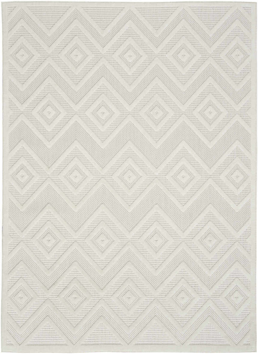 Close-up of the Nourison Versatile Ivory White Area Rug featuring a geometric diamond and zig-zag pattern.