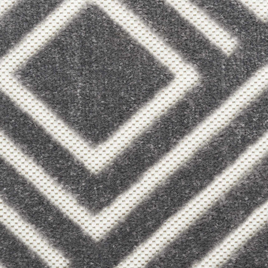 Close up of the Nourison Care Free Grey rug featuring a geometric diamond pattern.