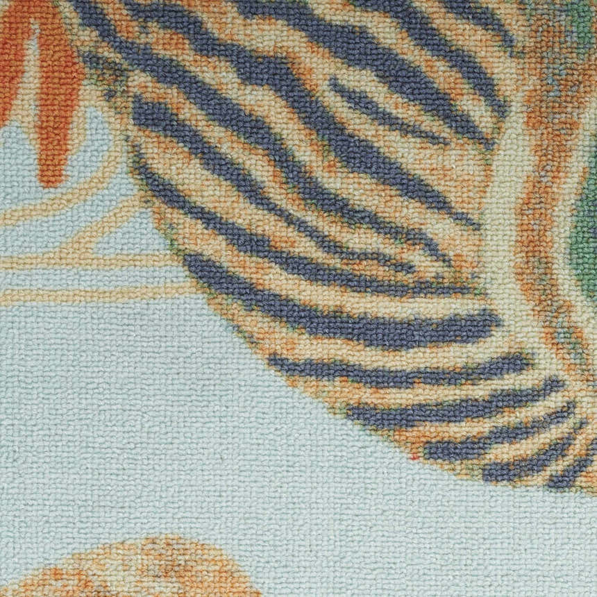 Close-up of the Waverly Sun N' Shade Light Blue rug showing its coastal-inspired pattern and soft, textured weave.