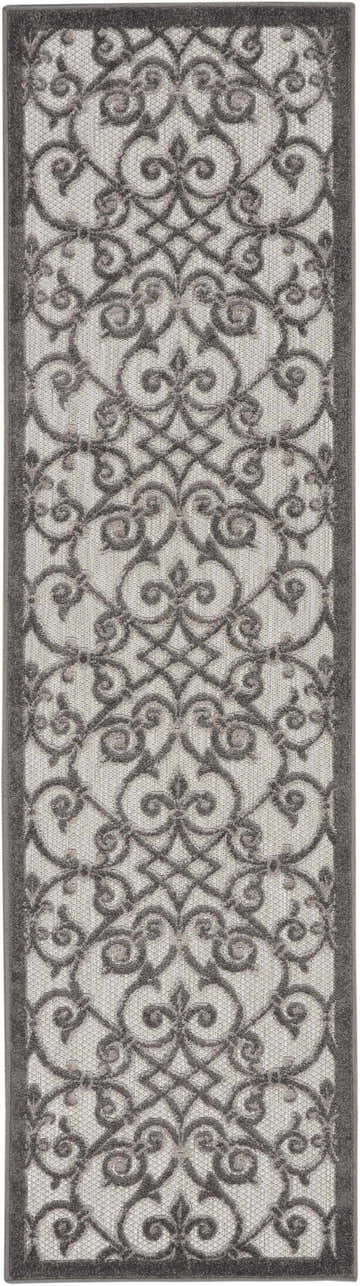 Close-up of the Nourison Aloha Grey Charcoal rug featuring a taupe floral trellis pattern and charcoal border.