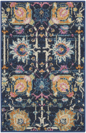 Close-up of the Nourison Passion Navy rug. Features a bohemian floral pattern with navy, gold, pink, and ivory hues.