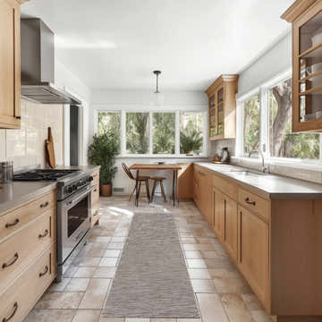 Light wood kitchen with Nourison Solutions Grey Mocha Modern Washable Area Rug runner between the stove and table.