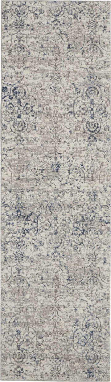 Close-up of Nourison Royal Terrace Beige Blue rug. Vintage style with beige, blue, and distressed pattern.