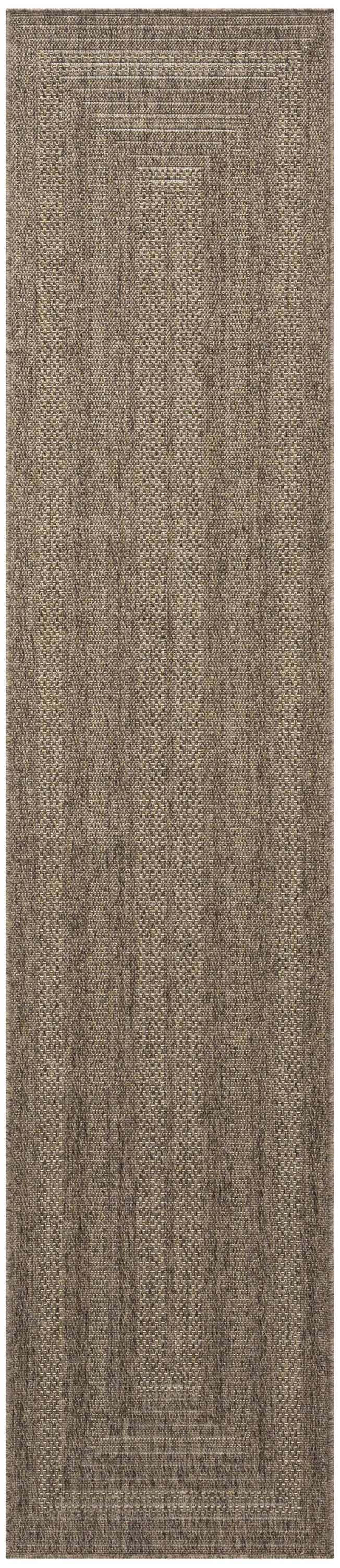 Close-up of the Nourison Tulum Brown Outdoor Area Rug, showing its textured pile and dark brown color.
