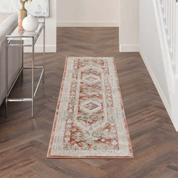 Hallway with Nourison Thalia Rust Multicolor rug runner on herringbone wood floor, vintage style.