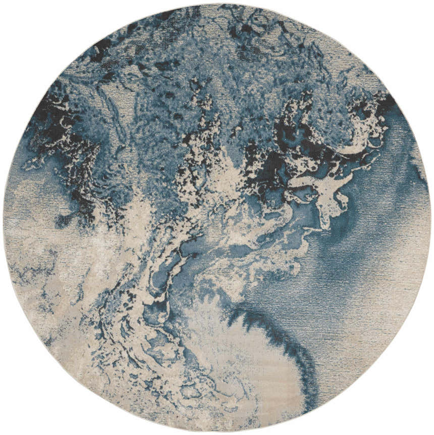 Round Nourison Maxell Ivory/Teal rug with a modern abstract design. Chestnut accents. Machine-made polyester rug.