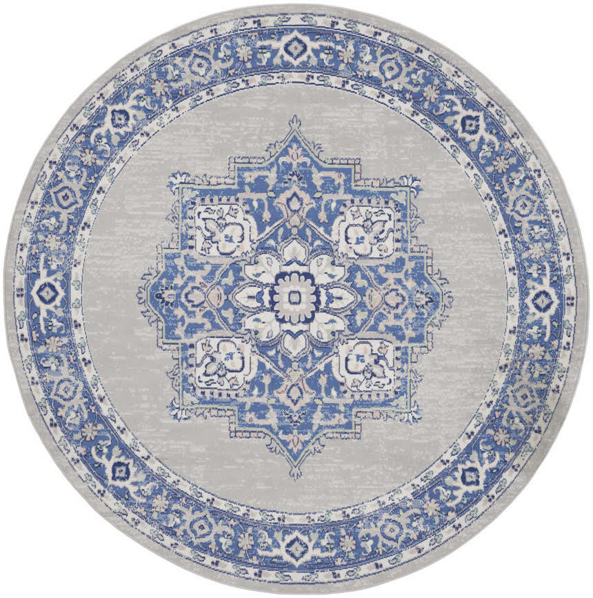 Round Nourison Whimsicle rug. Farmhouse style rug in grey and blue with a central medallion pattern and floral border.
