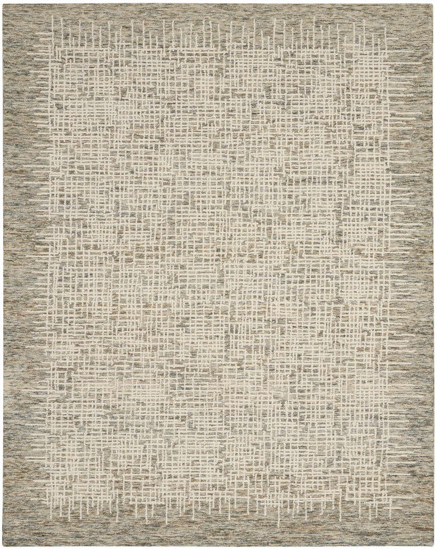 Close-up of Nourison Colorado Ivory Multicolor rug. Rustic Southwestern design with chestnut, cream, and textured wool.