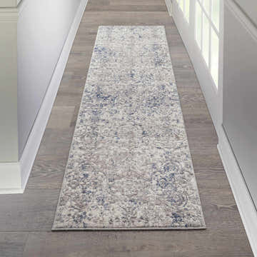 Hallway with a Nourison Royal Terrace Beige Blue vintage runner rug on wood floors.