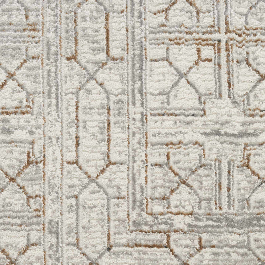 Close-up of Nourison Desire Ivory Beige Rug. Geometric pattern in ivory, beige, and gray hues. Soft, textured pile.