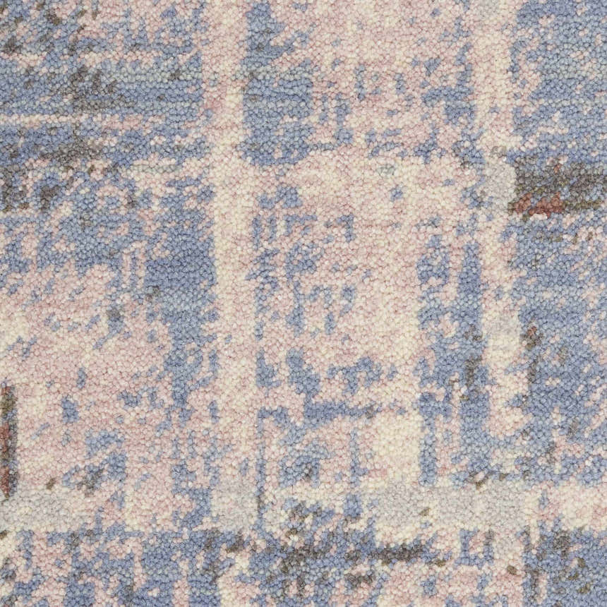 Close-up of the Nourison Artworks Multicolor area rug. Abstract pattern in shades of blue, pink, and cream. Wool and cotton texture.
