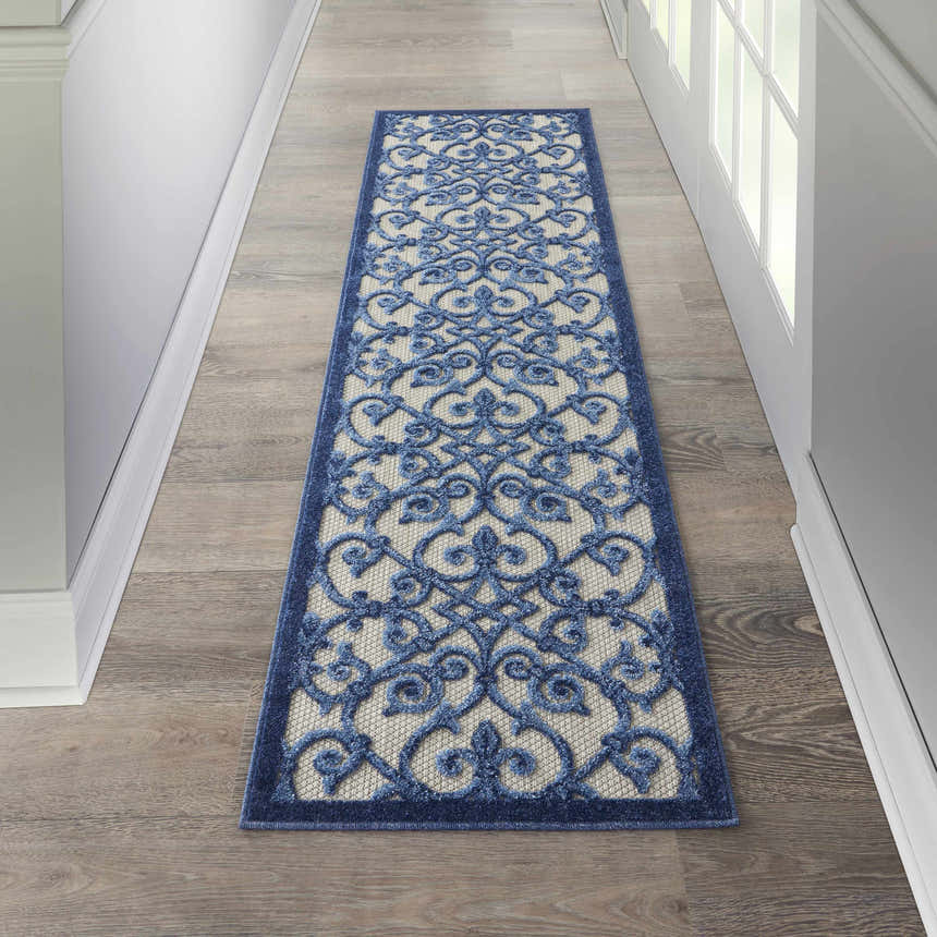 Hallway with Nourison Aloha Grey Blue Contemporary Area Rug runner on wood floor.