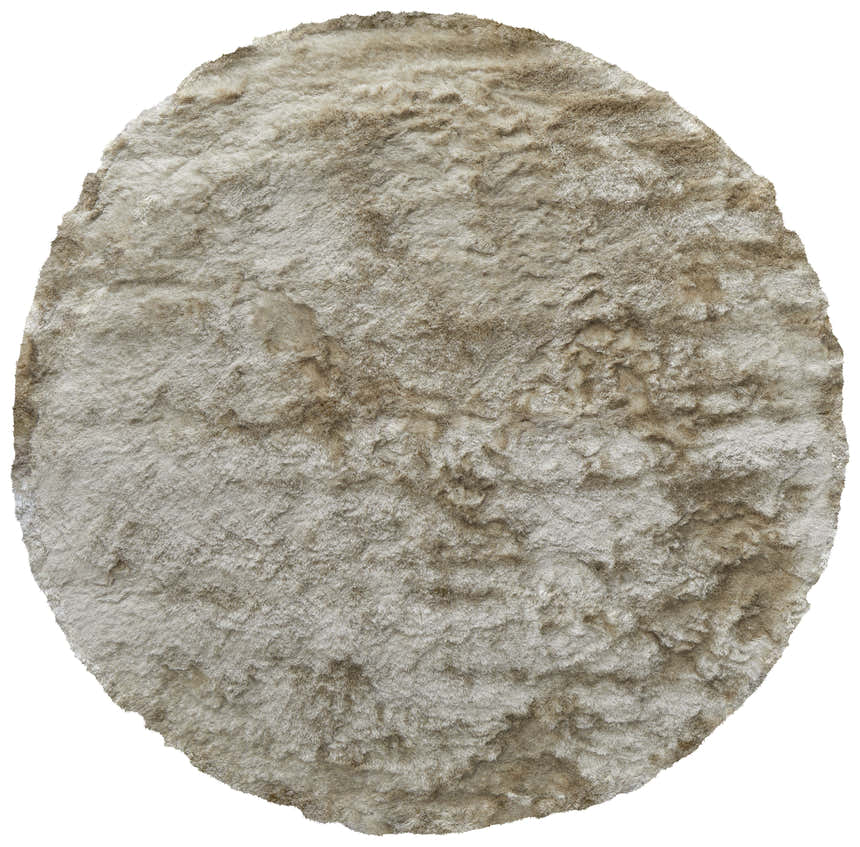 Close-up of the round Feizy Indochine Modern Solid rug. Tan and taupe tones with a soft, textured, hand-tufted design. Design-Round